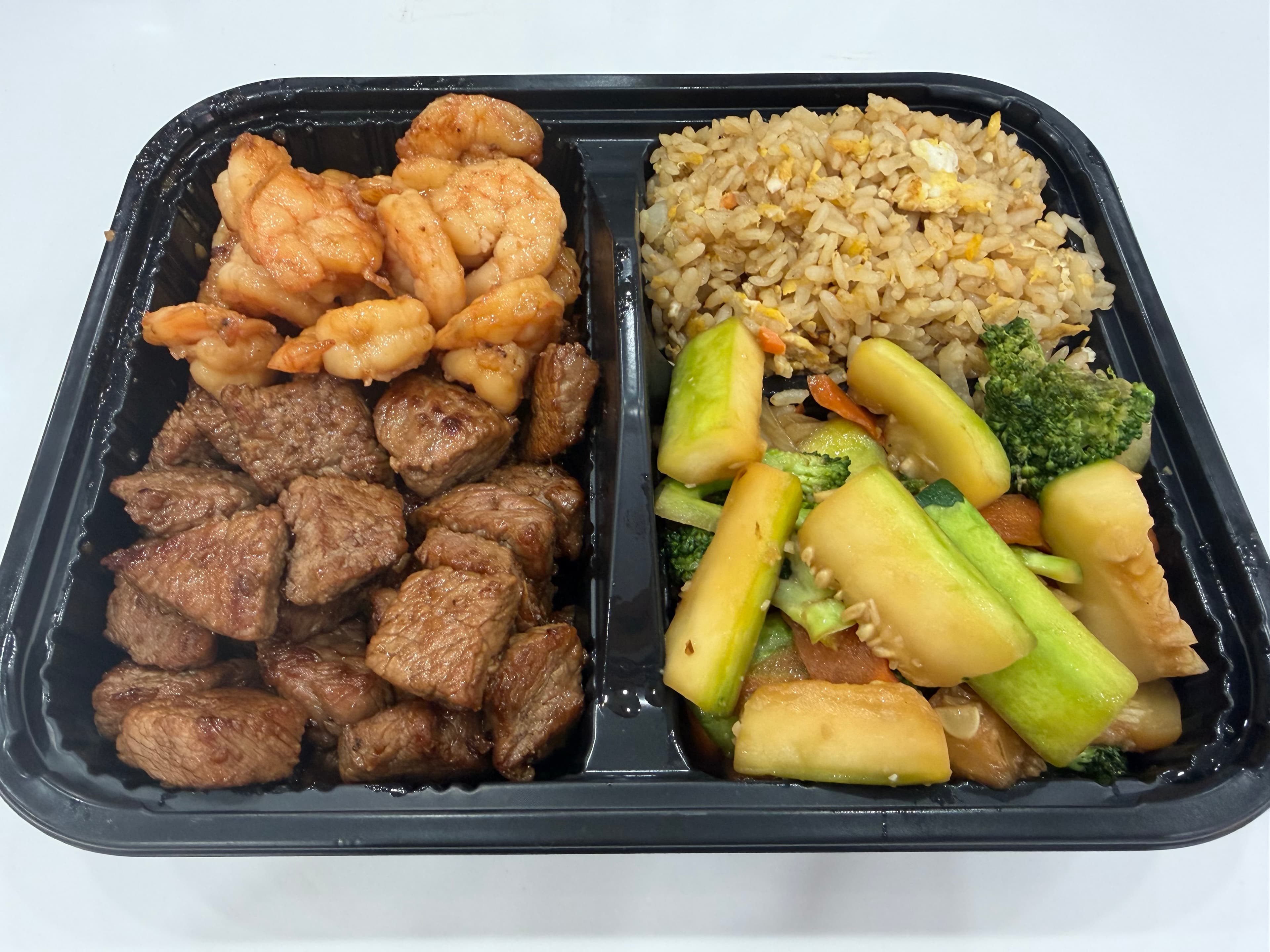 NY Strip Steak & Shrimp hibachi plate with fried rice and vegetables